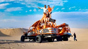 Image of the oasis surrounded by giant dunes and buggies in full action.