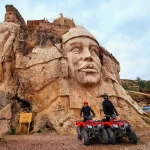 ATV riders exploring the Abode of the Gods in Cusco, surrounded by stone sculptures and Andean landscapes during an adventure tour.