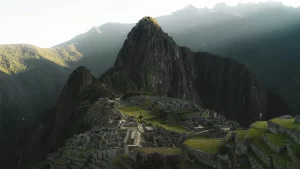 Trekker arriving at Machu Picchu after completing the Short Inca Trail, enjoying views of the citadel, terraces, and surrounding mountains.